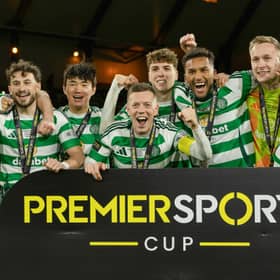 Celtic players celebrate after winning the Premier Sports Cup final