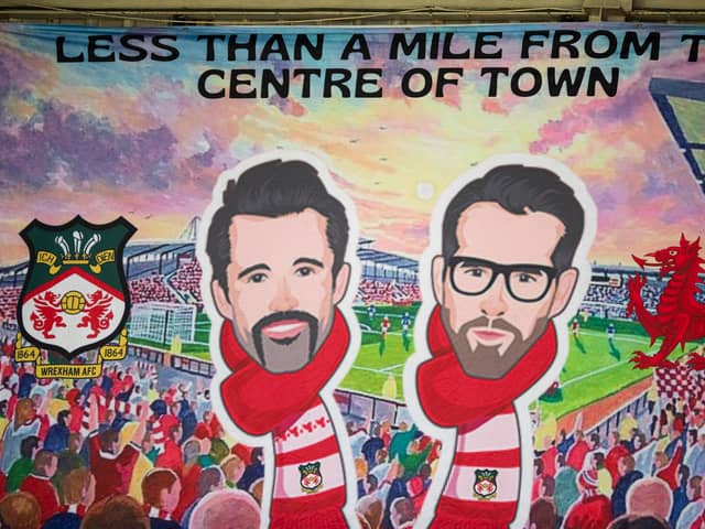 A banner of Wrexham owners Rob McElhenney and Ryan Reynolds