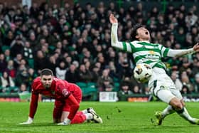 Celtic's Hyun-jun Yang is brought down in the box by Motherwell goalkeeper Aston Oxborough. (Photo by Rob Casey / SNS Group)
