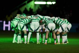 Celtic players enter a traditional pre-match huddle prior 
