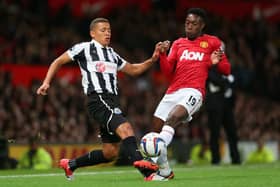 Danny Welbeck of Manchester United tackles James Tavernier of Newcastle United during the Capital One Cup Third Round match at Old Trafford in September 2012