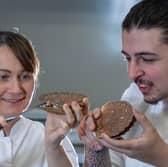 Michelin-starred chef Lorna McNee showing Rory Doherty, cookery student at City of Glasgow College, how to shuck a hand-dived scallop at masterclass organised by Seafood Scotland