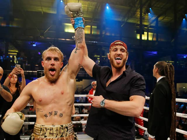 Jake Paul (left) and Logan Paul (right) have faced opponents in the ring over the years, but new social media posts have fans thinking a brotherly brawl could be on the cards. 