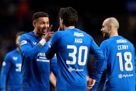 Ianis Hagi of Rangers FC celebrates scoring his team's second goal against Ross County with teammate James Tavernier