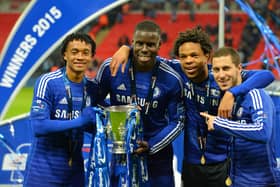 Chelsea midfielder Juan Cuadrado (L), defender Kurt Zouma, striker Loic Remy (2nd R) and midfielder Eden Hazard (R) celebrate with the League Cup final trophy in March 2015