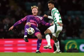 Jort van der Sande of Dundee United vies with Auston Trusty of Celtic 