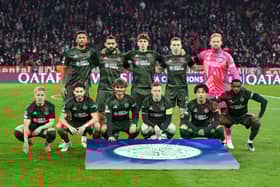 Celtic players pose for a photo on pitch prior to the UEFA Champions League League Knockout Play-off second leg