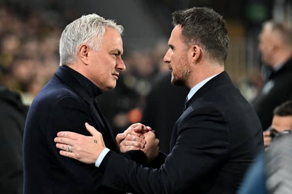 Fenerbahce coach Jose Mourinho (L) embraces Rangers' interim boss Barry Ferguson 