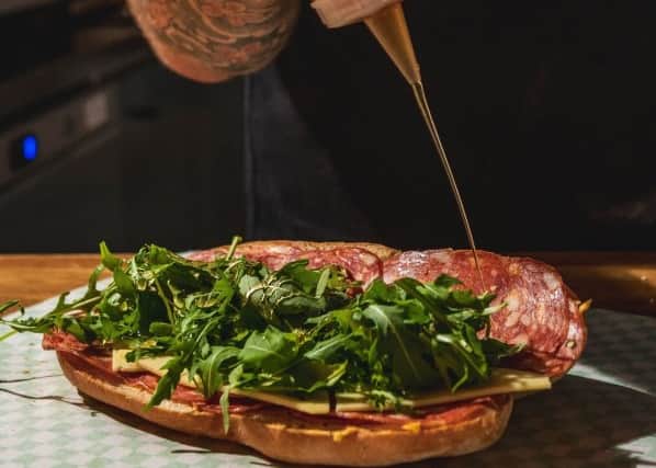 The Spicy Salami from Sub126 featuring Spicy salami, cheddar, rocket, hot honey and sriracha butter