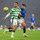 Adam Idah of Celtic and Robin Propper of Rangers FC compete for the ball 