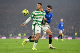 Adam Idah of Celtic and Robin Propper of Rangers FC compete for the ball 