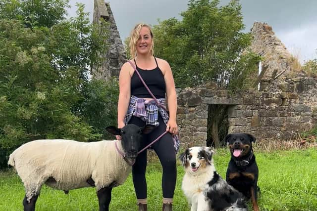 Robyn Swan moved out of her home to live rent-free in a container in rural Scotland, growing her own food and harvesting rainwater. She is pictured with her pet sheep and dogs.