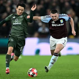 Aston Villa midfielder John McGinn battles for the ball with Celtic winger Yang Hyun-Jun during the Champions League clash at Villa Park