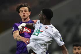 Toulouse's Danish defender Rasmus Nicolaisen (L) fights for the ball with Guingamp's French midfielder Kalidou Sidibe during a French Cup clash (Pic: Getty)