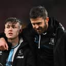 Michael Carrick, manager of Middlesbrough, interacts with Ben Doak