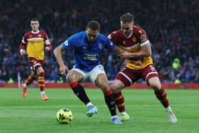 Cyriel Dessers of Rangers FC is challenged by Kofi Balmer of Motherwell