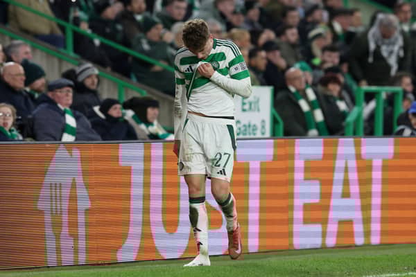 Arne Engels of Celtic looks dejected as he leaves the field