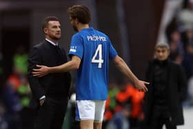 Rangers defender Robin Propper talks with interim head coach Barry Ferguson on the touchline following his red card