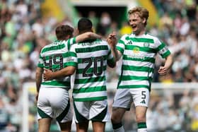 Cameron Carter-Vickers is mobbed by his Celtic teammates after scoring a stunning strike against Kilmarnock.
