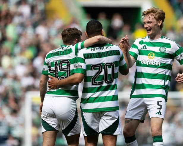 Cameron Carter-Vickers is mobbed by his Celtic teammates after scoring a stunning strike against Kilmarnock.