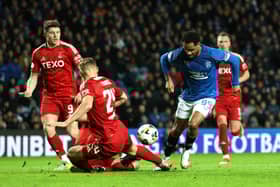 Danilo of Rangers FC is challenged by Kristers Tobers of Aberdeen