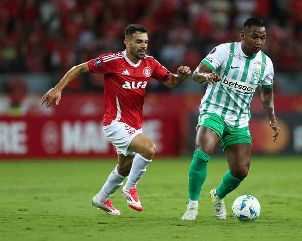  Bruno Henrique of Internacional and Alfredo Morelos of Atletico Nacional compete for the ball