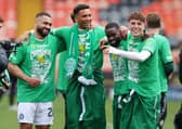 Cameron Carter-Vickers, Auston Trusty, Jeffrey Schlupp and Arne Engels of Celtic are seen celebrating the club's title triumph