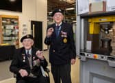 Veterans Richard Pelzer (left), 101, and Ron Horsey, 98, who both served with the Royal Engineers, holding the new VE Day 50p coin at the Royal Mint manufacturing site in South Wales (Photo: The Royal Mint)