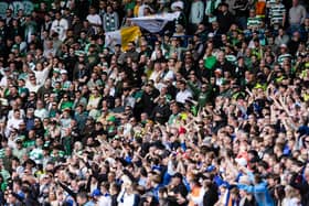 Rangers and Celtic fans roar on their respective sides at Ibrox.