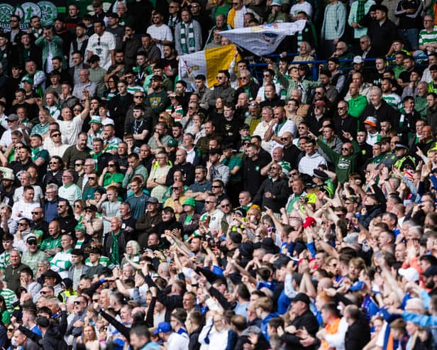 Rangers and Celtic fans roar on their respective sides at Ibrox.