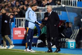 Carlo Ancelotti, Head Coach of Real Madrid, interacts with his assistant, Davide Ancelotti