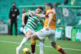 James Forrest of Celtic is challenged by Stephen O'Donnell of Motherwell 