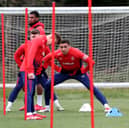 James Tavernier of Rangers stretches ahead of starting a training drill at Auchenhowie