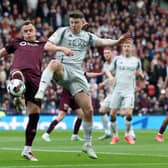 Lawrence Shankland of Heart of Midlothian vies with Kevin Nisbet of Aberdeen during the Scottish Gas Scottish Cup Semi Final match between Heart Of Midlothian and Aberdeen at Hampden Park on April 19, 2025 in Glasgow, Scotland. (Photo by Ian MacNicol/Getty Images)