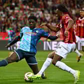 Le Havre defender Etienne Youte (left) is being tracked closely by Celtic
