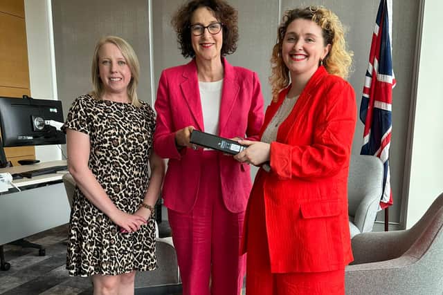 Health writer Sarah McCann and Laura Collins (Publisher, Worlds Division, National World), handing over the folder containing over 400 anonymous responses to our Endo the Battle survey to Baroness Merron, Minister for Patient Safety, Women's Health and Mental Health.