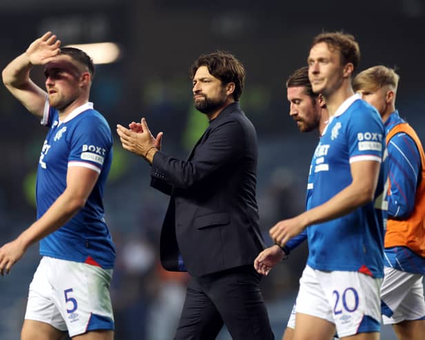 Russell Martin, Manager of Rangers, applauds the fans