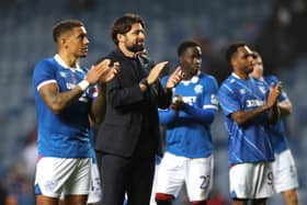 Russell Martin, Manager of Rangers, applauds the fans with his players at full-time