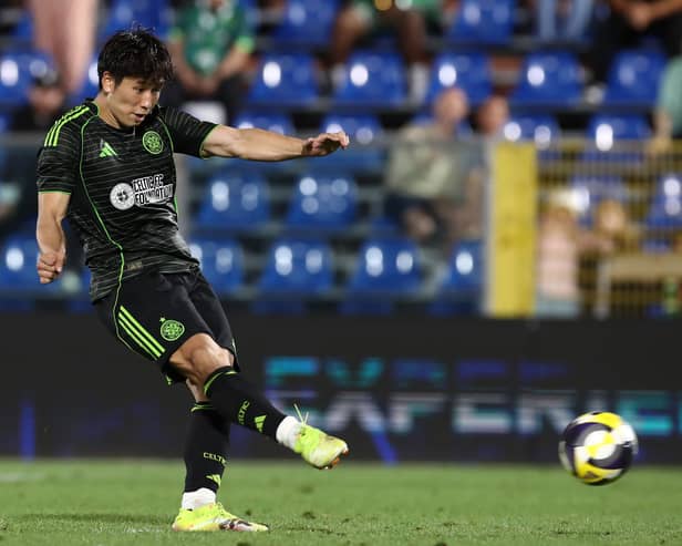 Shin Yamada of Celtic scores from the penalty spot during the Como Cup shootout against Al-Ahli