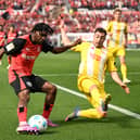 Bayer Leverkusen defenderJeremie Frimpong (L) and Union Berlin full-back Josip Juranovic vie for the ball