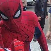 Tom Holland high-fives boy while filming Spider-Man in Glasgow.