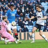 Scott Bain of Falkrik vies with Bojan Miovski of Rangers