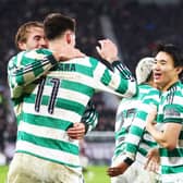 Celtic players celebrate scoring a goal