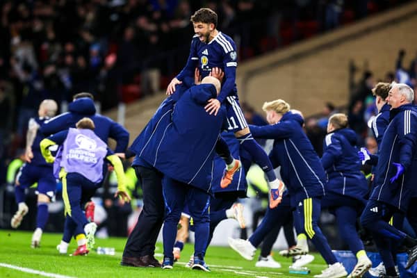 Ryan Christie celebrates with Scotland head coach Steve Clarke after the 4-2 win over Denmark at Hampden secured qualification for the World Cup. (Photo by Alan Harvey / SNS Group)