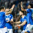Rangers' Nicolas Raskin (C) celebrates with fellow goalscorers James Tavernier (L) and Tochi Chukwuani after a 4-1 win over Aberdeen.