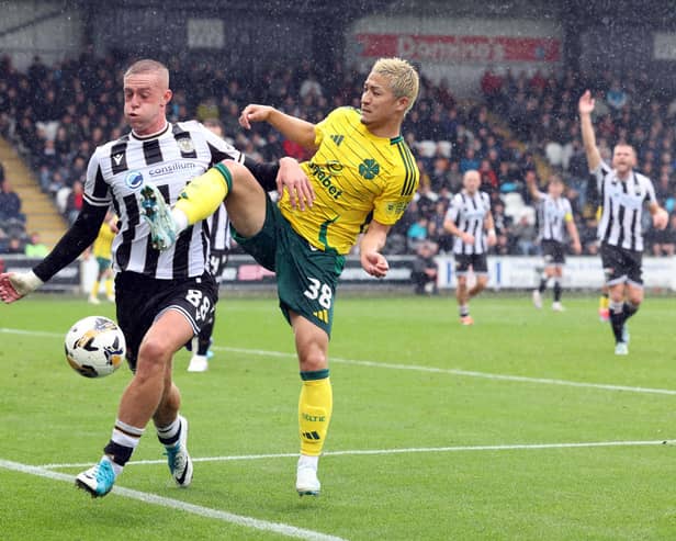 Killian Phillips of St Mirren vies with Daizen Maeda of Celtic 