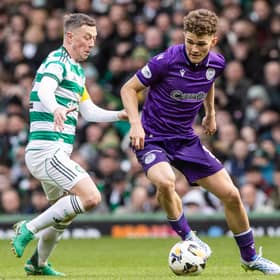 St Mirren's Jacob Devaney (R) and Celtic's Callum McGregor battle for the ball at Parkhead on Saturday.