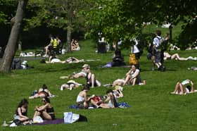 Sunbathers in Kelvingrove Park, Glasgow, on Tuesday