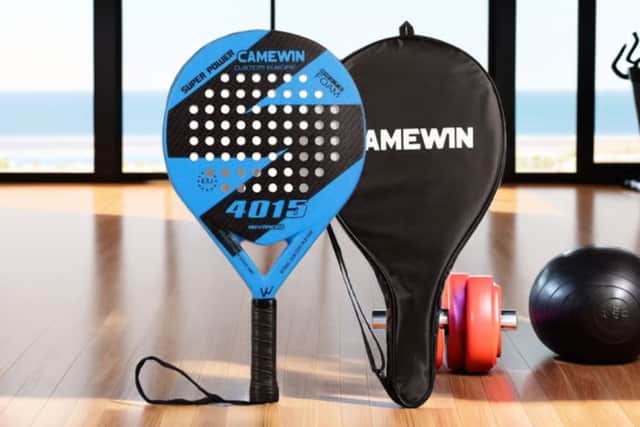 The carbon fibre padel racket features an EVA memory foam core and textured grip face for improved control.