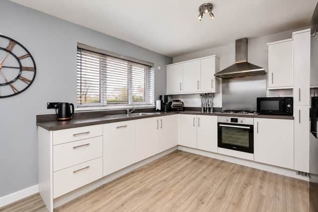 The spacious kitchen and dining area provide a sociable hub for busy family life